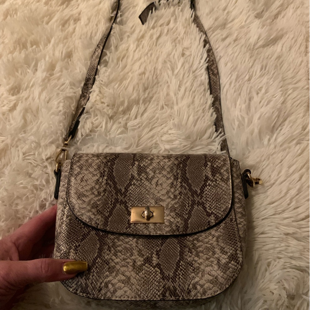 Mellow World designer crossbody bag snake skin look.